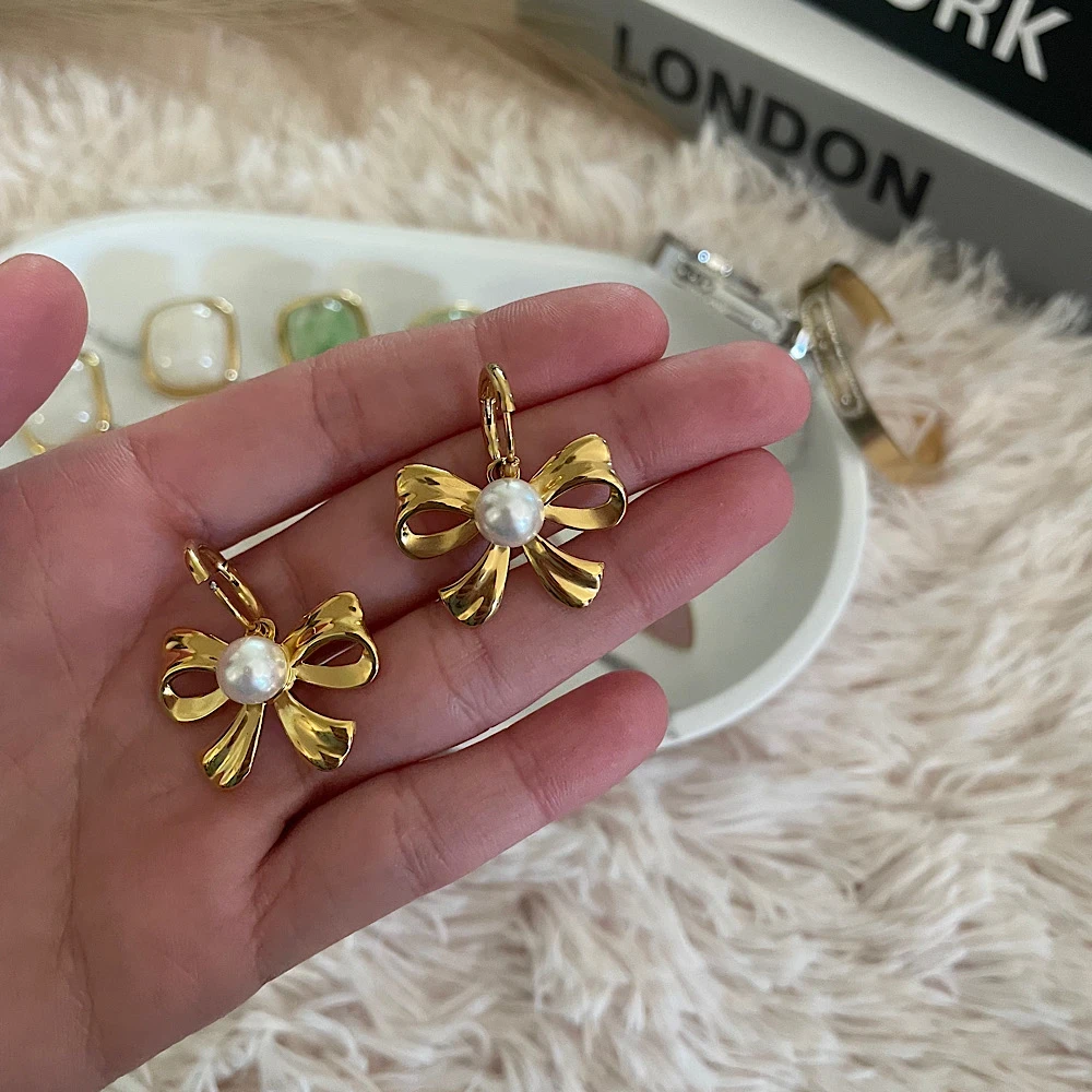 Bow&pearl-steel earrings.