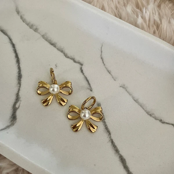 Bow&pearl-steel earrings.