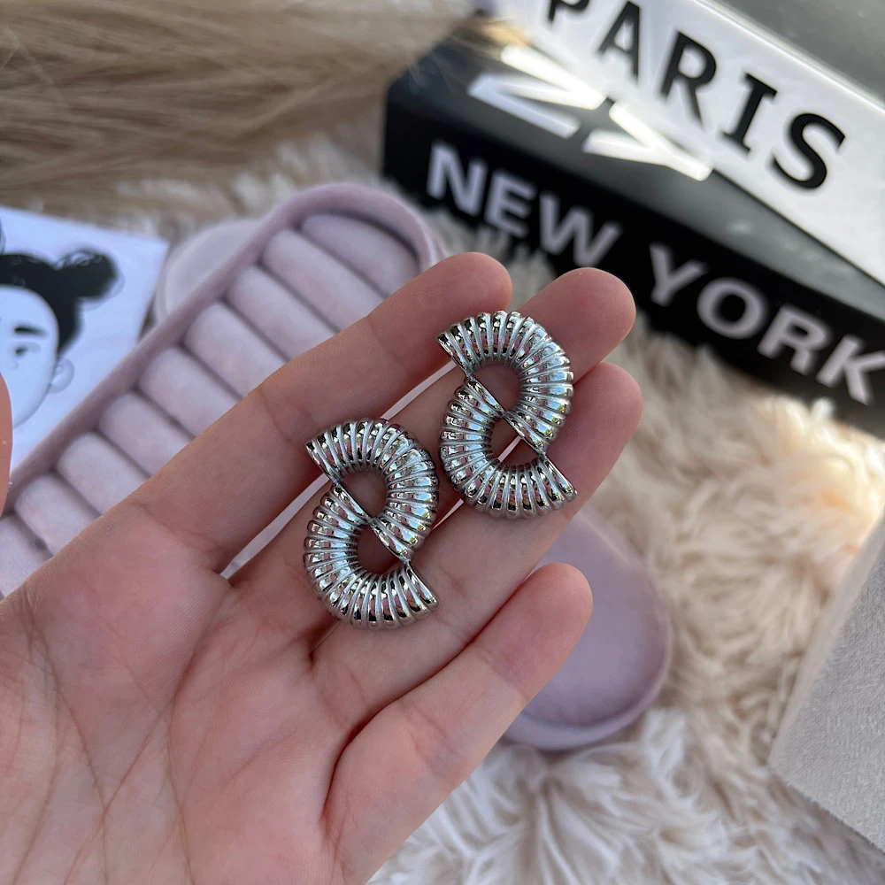 Helix Shine Steel earrings.